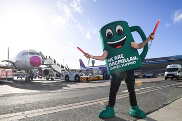 Macmillan's mascot Muggy at London Luton Airport