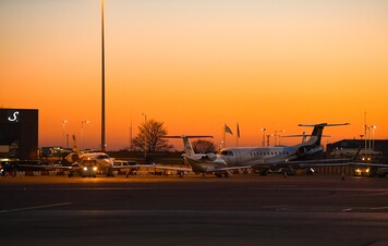 Private jets at dusk
