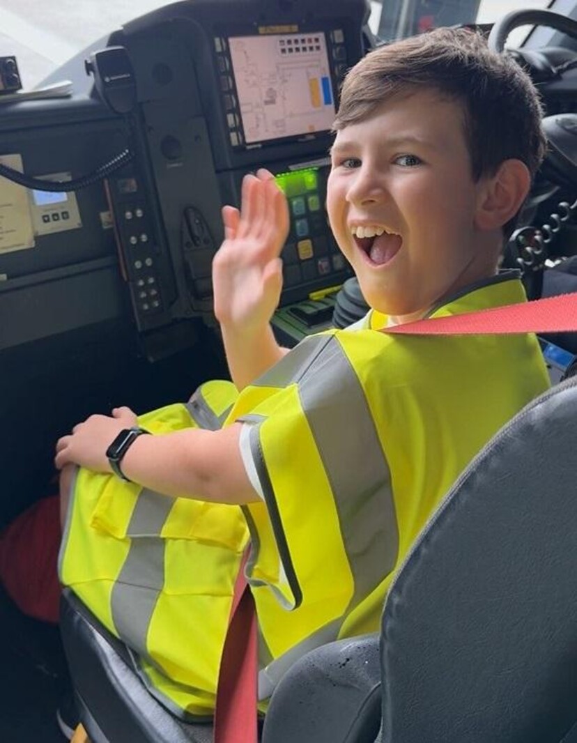 Seth Drinkell getting a ride in LLA's fire truck